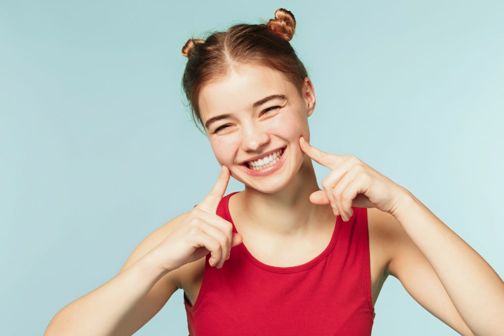 A teenage girl with a big smile