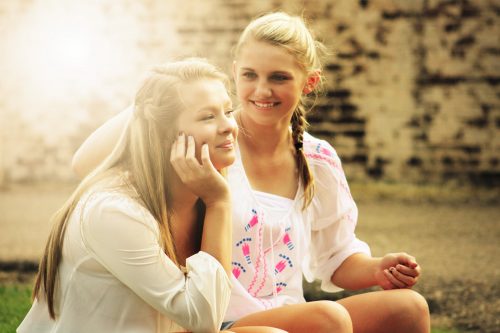 a young woman offering a friend support